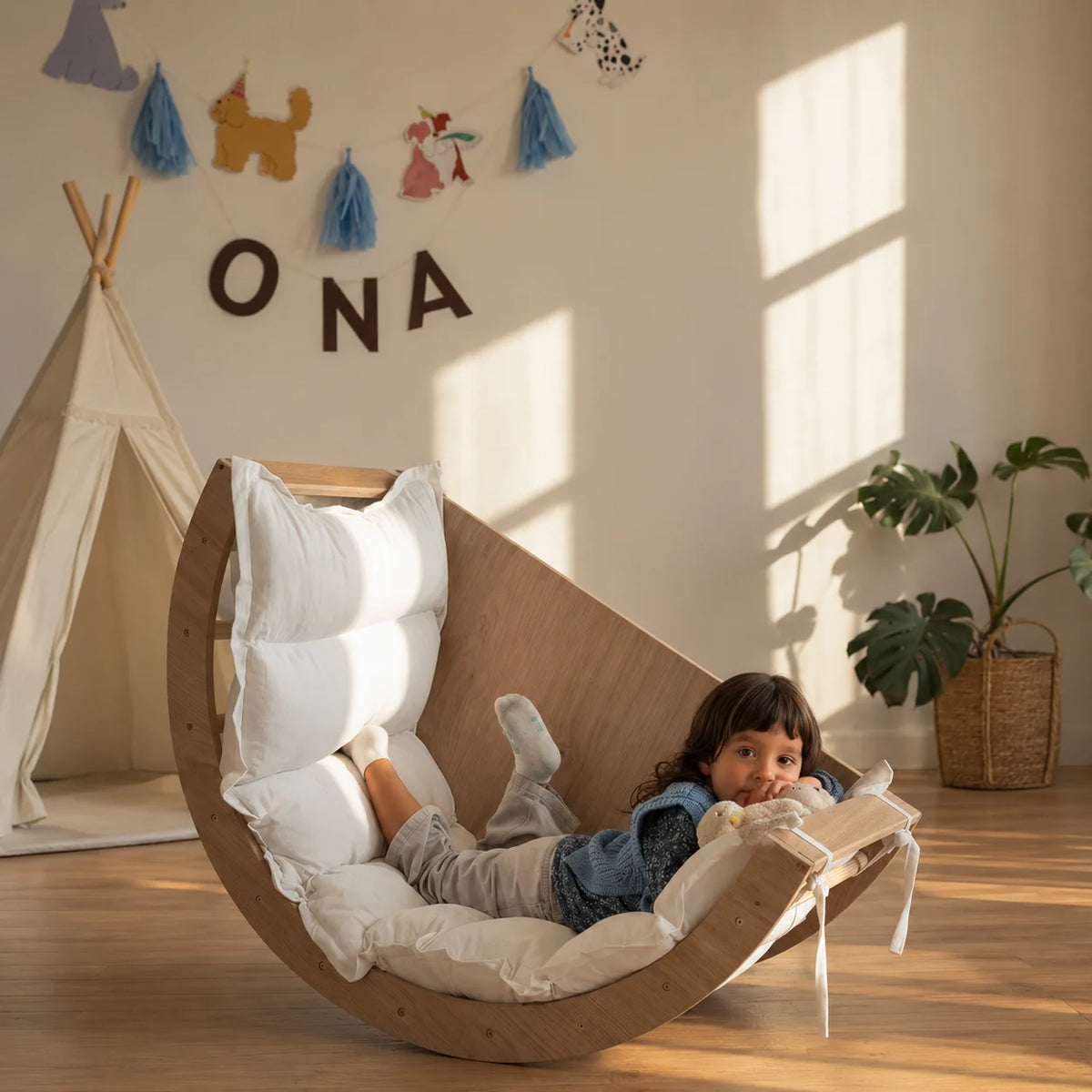 A beautifully designed curved lounge chair created to bring comfort, movement, and warmth into your child’s space.