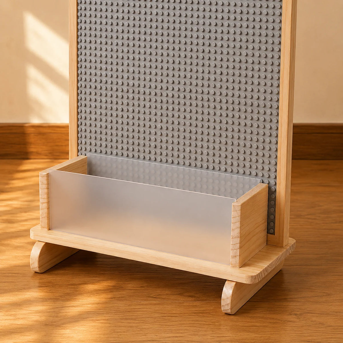 A light natural wood desk organizer with a frosted glass tray, shown on a wooden floor against a white wall.