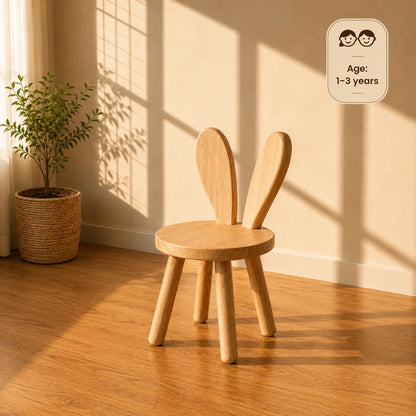 A light natural wood storage cubby shelf with slanted bins on top, shown against a warm beige wall with sunlight shadows and a wood floor.