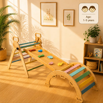 A wooden toddler climbing and balancing toy set in a warm, sunlit nursery. The toy features a natural wood frame with colorful pastel bars in blue, green, pink, yellow, and orange, along with small wooden animal shapes on the slide.