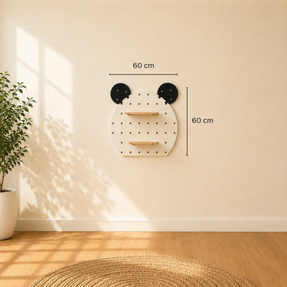 A white cloud-shaped pegboard wall shelf with two light wood shelves mounted on a beige wall, with warm sunlight casting windowpane shadows on the wall and light wood floor.