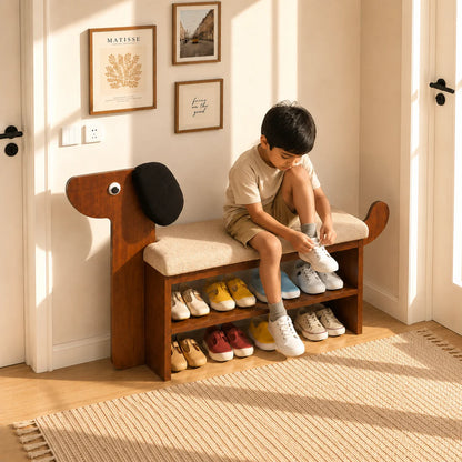 A child sits on a wooden entryway bench with a dog-shaped head and beige cushion, tying shoes while sneakers are displayed on the shelves in a bright room.